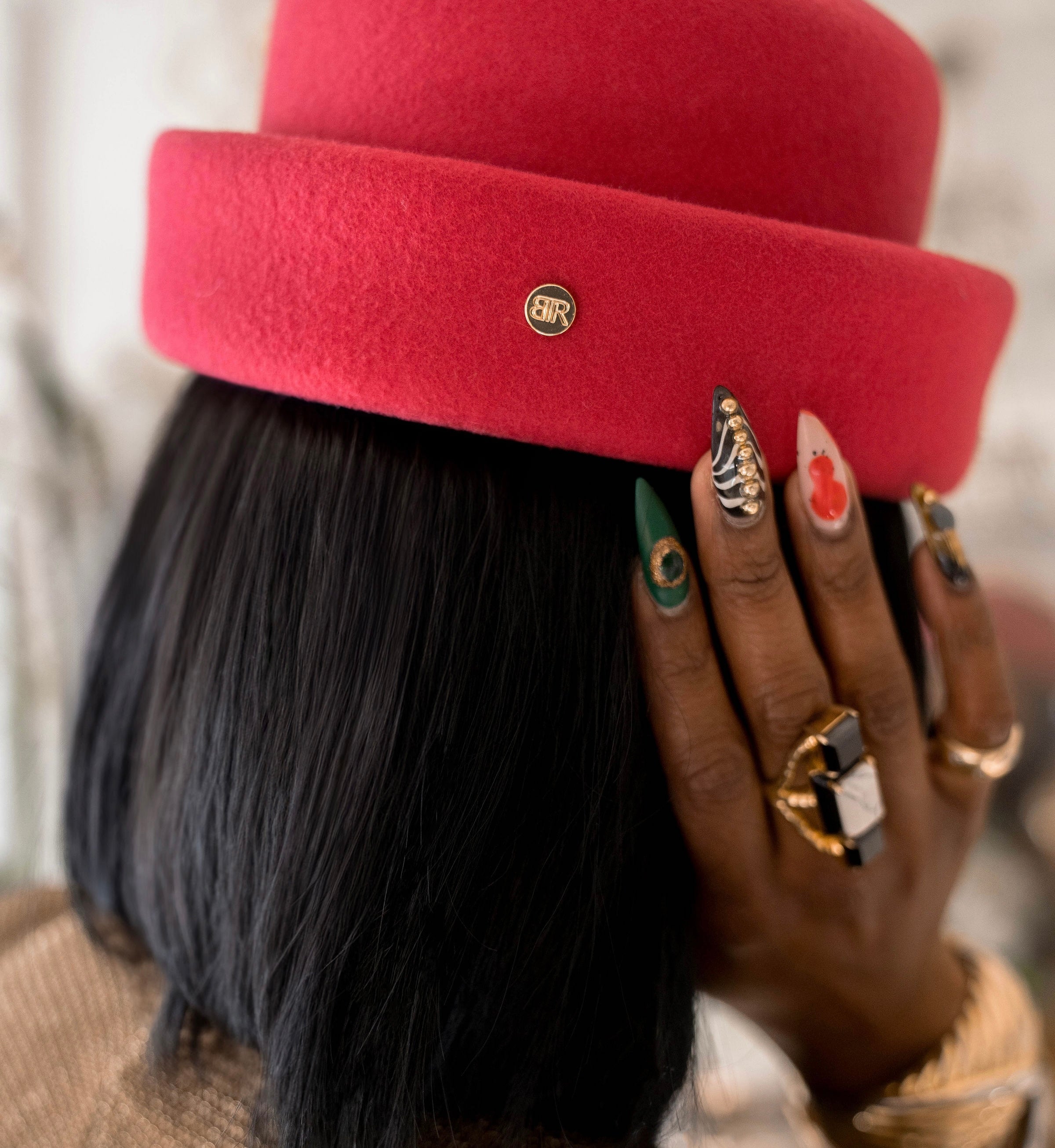 elegant woman in viva magenta london pillbox hat