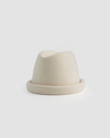 Ivory Russian pillbox hat by Born To Roam featuring a sleek, rounded design and elegant style.