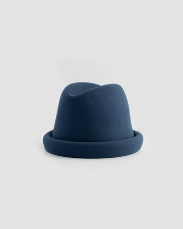 Navy Russian pillbox hat by Born To Roam featuring a sleek, structured design with a small brim and classic style.