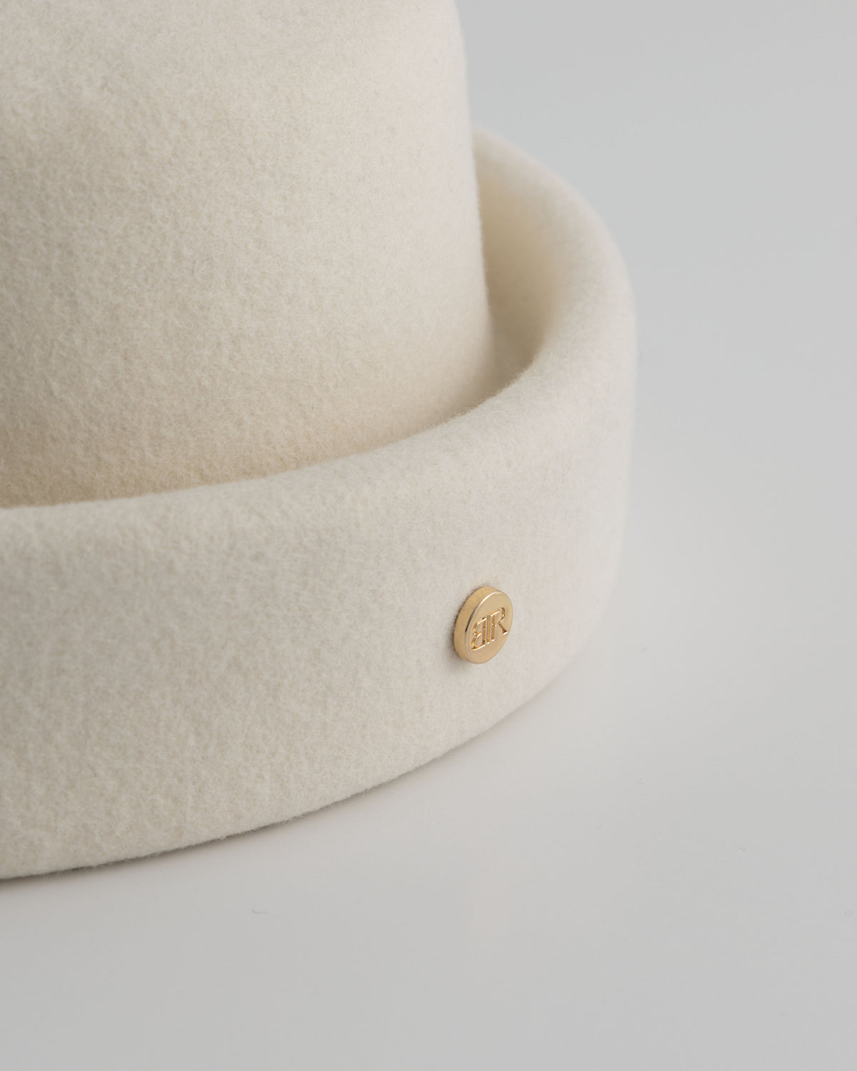 Born To Roam ivory London pillbox hat with a sleek, structured design for stylish, vintage-inspired fashion.