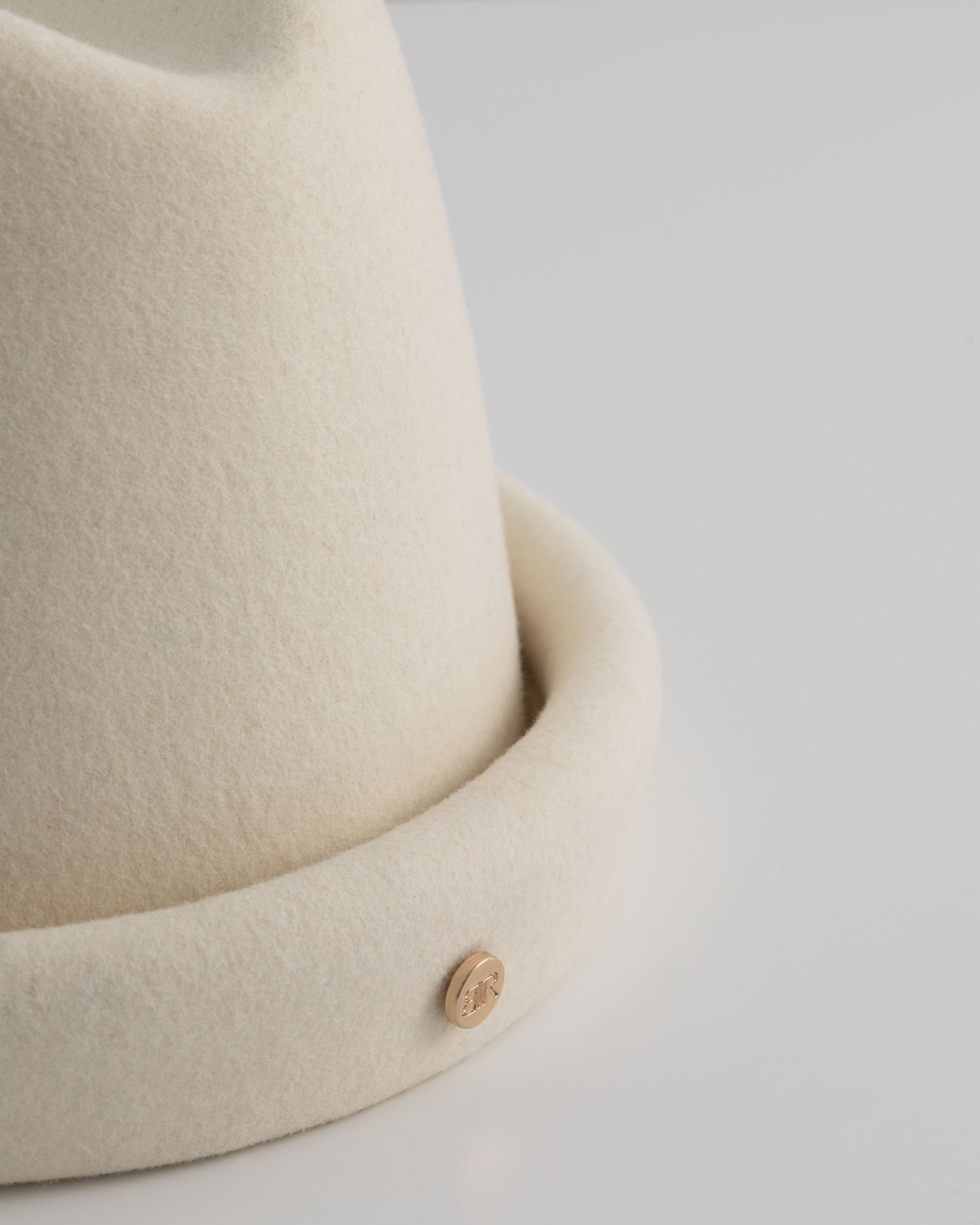Ivory Russian Pillbox Hat by Born To Roam, featuring a sleek, structured design perfect for stylish headwear.