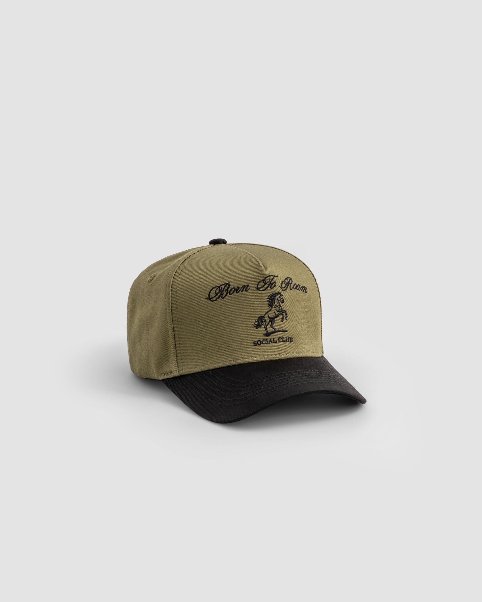 Born To Roam American Trucker Cap in olive green, showcasing a classic baseball cap style with mesh back and adjustable strap.