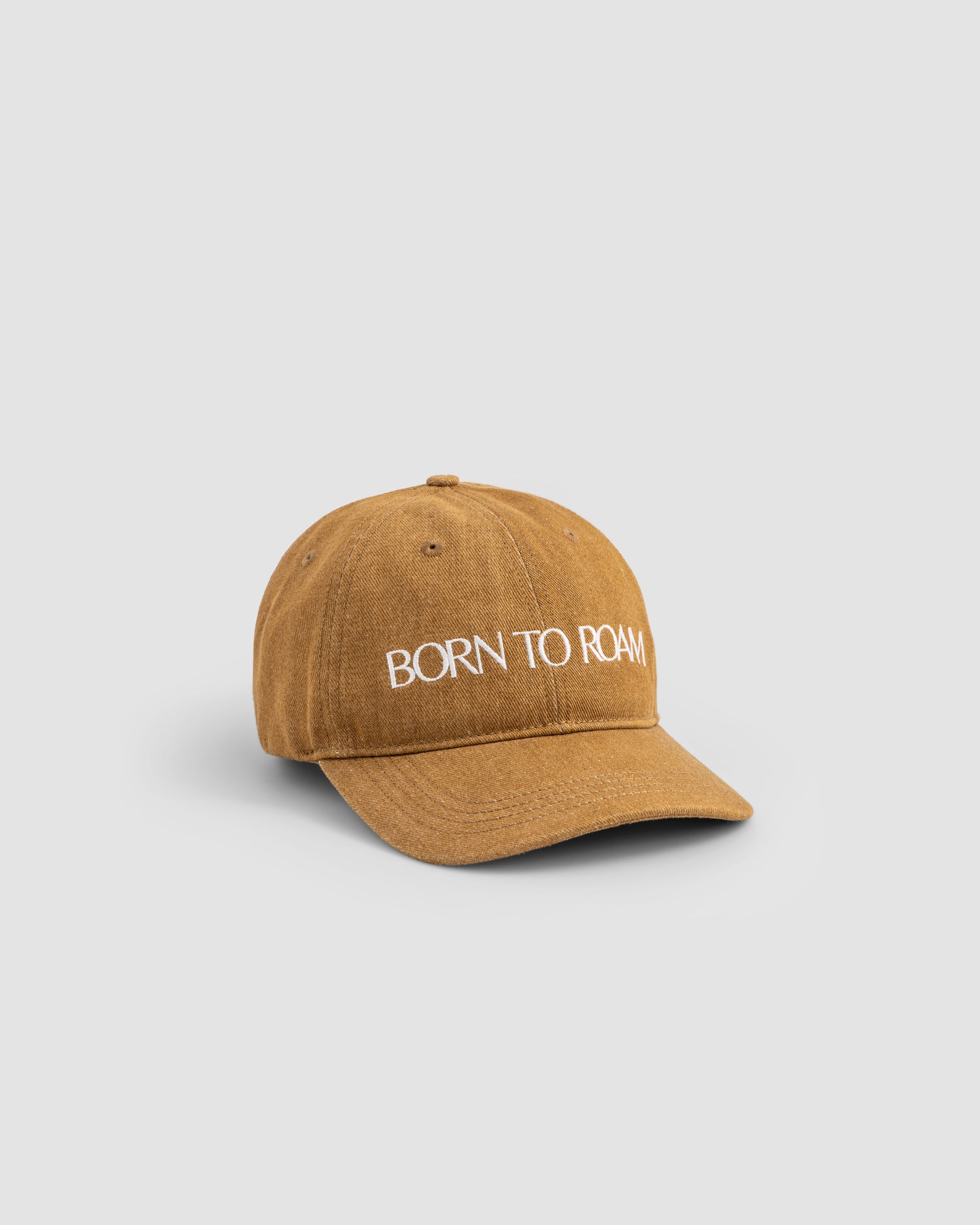 Born To Roam Queens Baseball Cap in khaki, featuring a classic design and adjustable strap, shown in a front view.