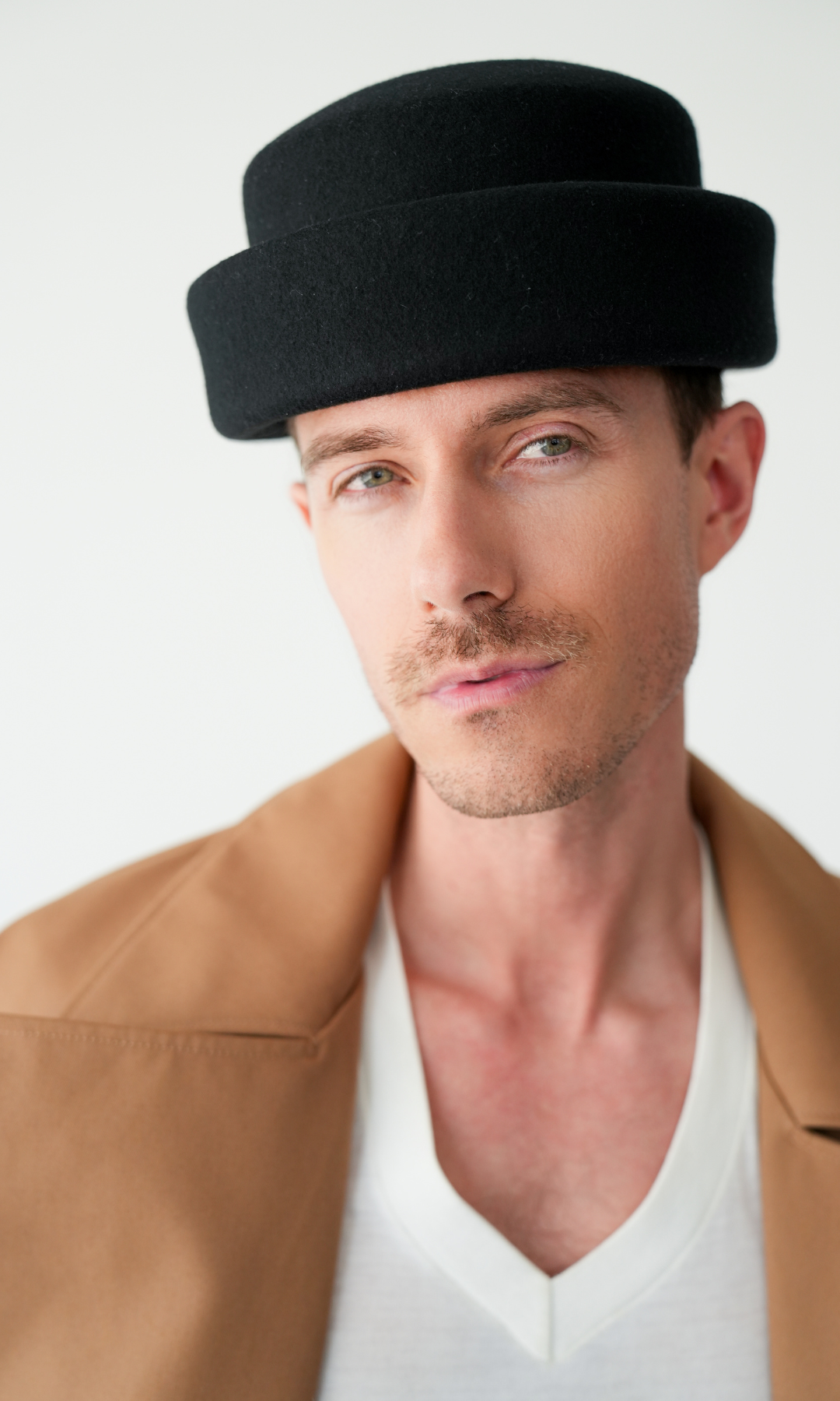 Born To Roam London Pillbox Hat in black, stylish vintage-inspired hat with a sleek, rounded design and a narrow brim.