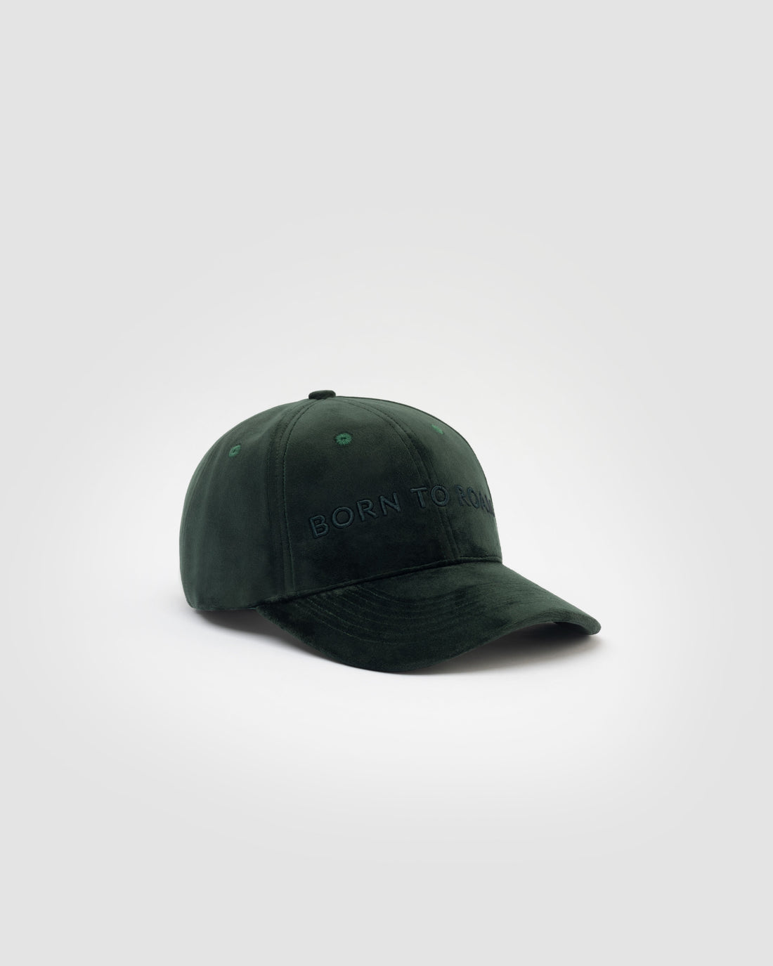 Born To Roam Queens Velvet Baseball Cap in dark green, showcasing soft velvet material and classic curved brim.