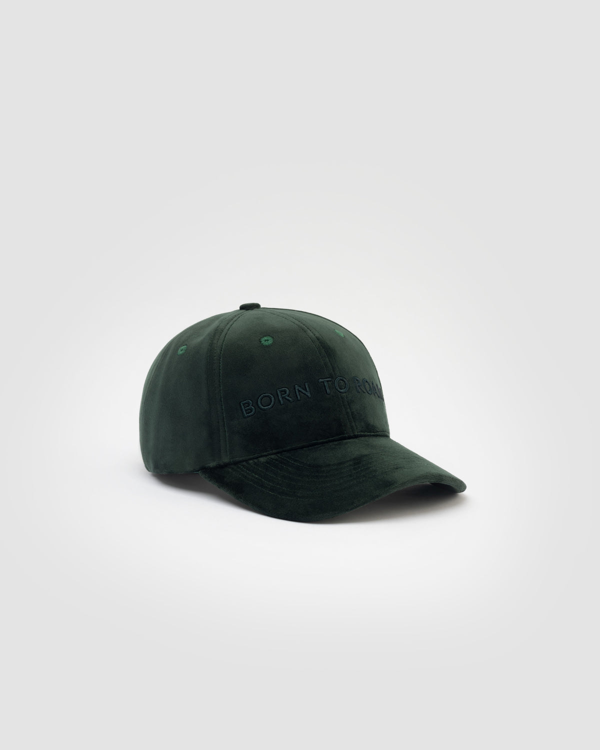 Born To Roam Queens Velvet Baseball Cap in dark green, showcasing soft velvet material and classic curved brim.