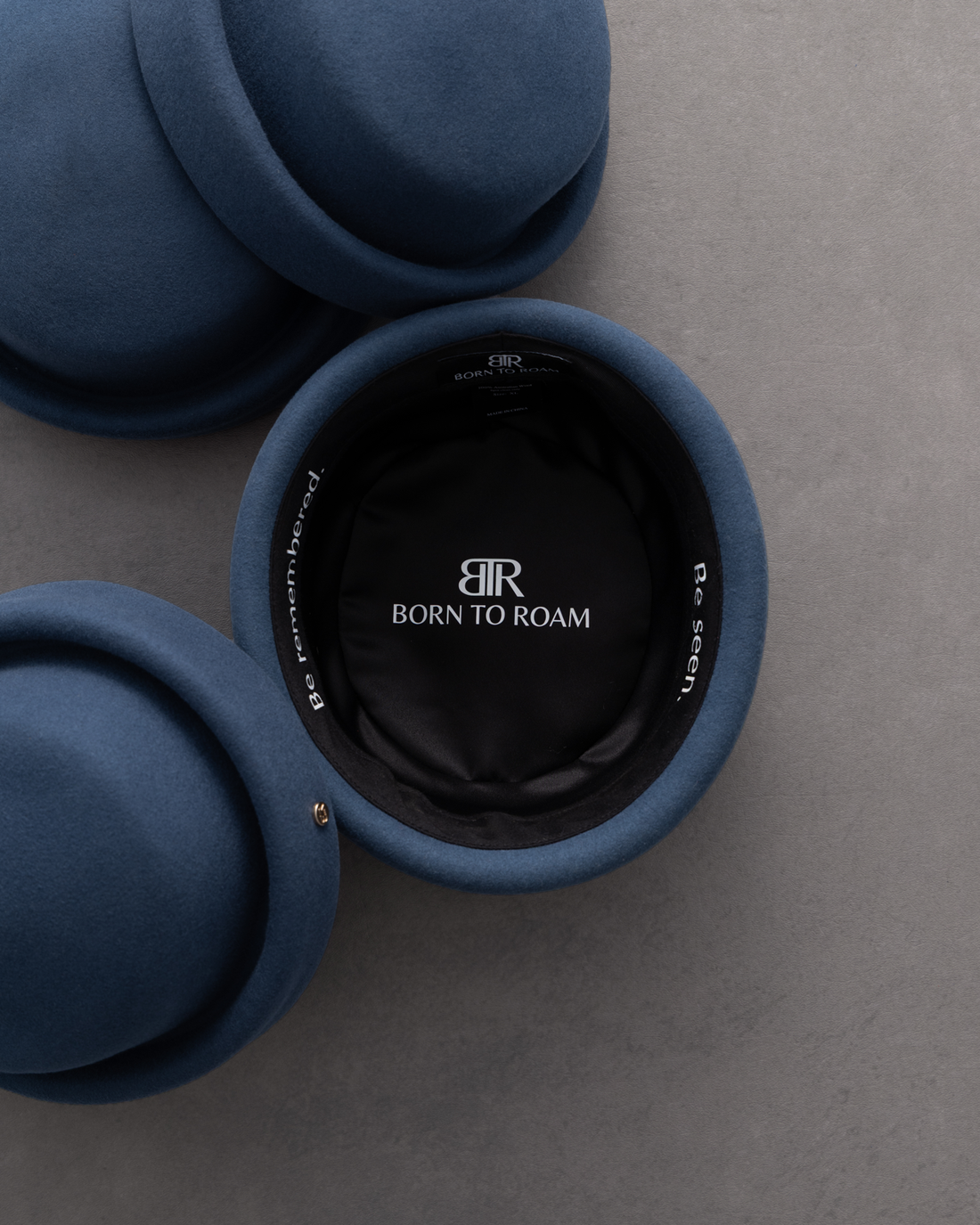 Born To Roam London Pillbox Hat in navy, stylish small round hat with a sleek, classic design perfect for vintage-inspired fashion.