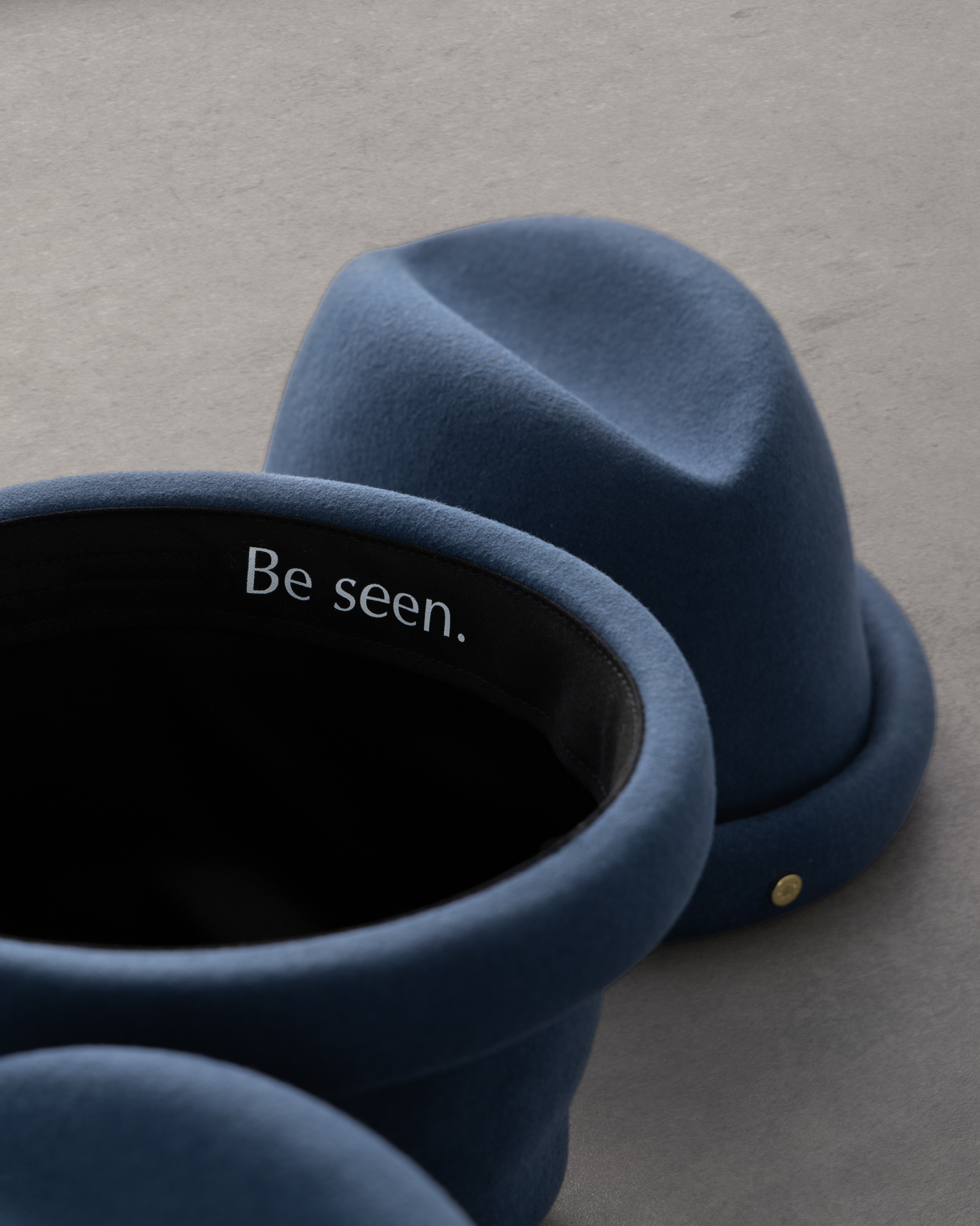 Navy Russian Pillbox Hat by Born To Roam featuring a classic, structured design with a small brim and decorative band.