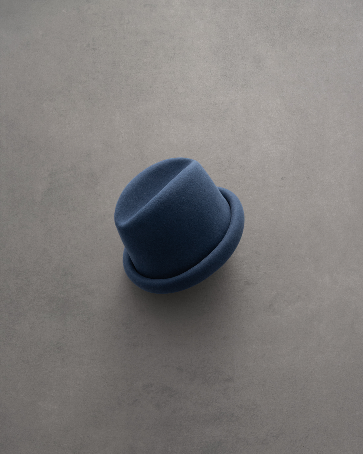 Born To Roam Alpine navy pillbox hat with a sleek, rounded design and subtle branding details, perfect for stylish accessories.