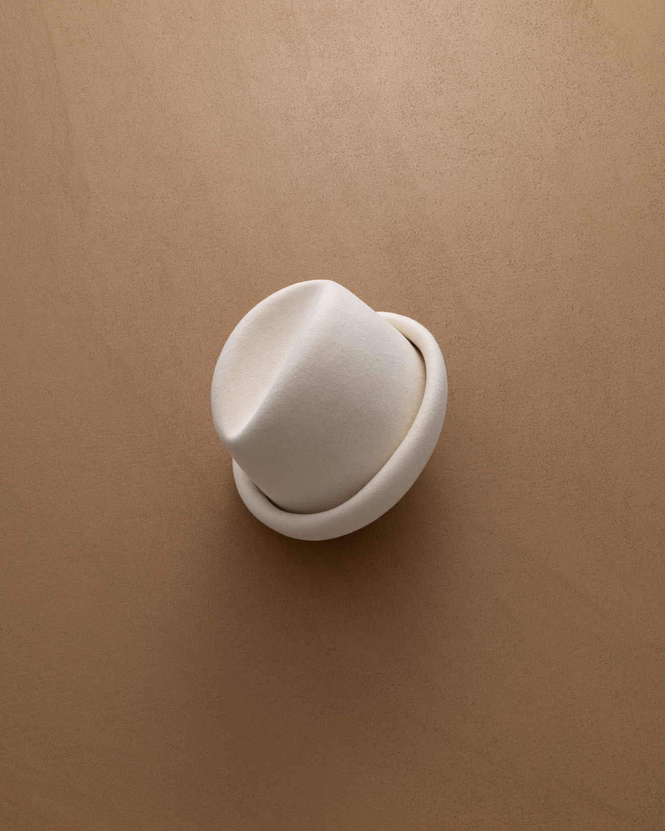Ivory Russian Pillbox Hat by Born To Roam featuring a sleek, structured design with a small brim and elegant detailing.