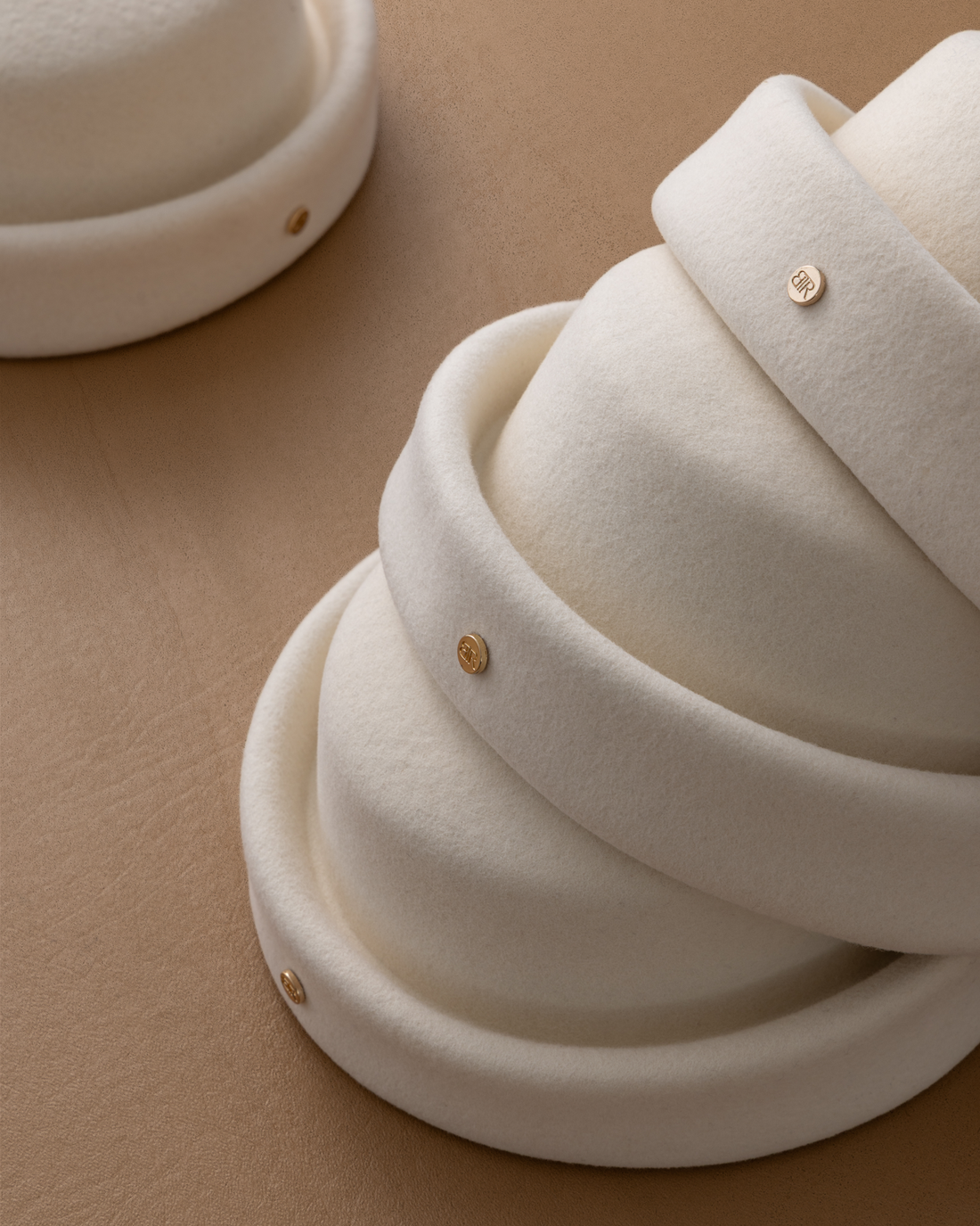 Ivory London Pillbox hat by Born To Roam with a sleek, structured design and elegant vintage style.