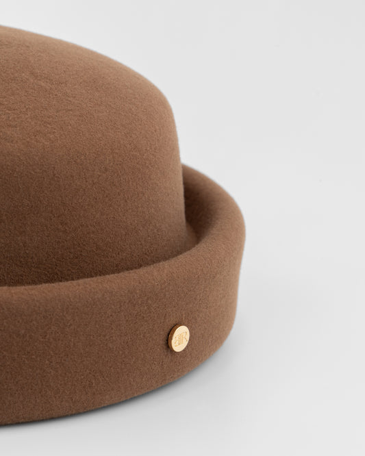 Chocolate brown London Pillbox hat by Born To Roam, featuring a structured design and elegant style.