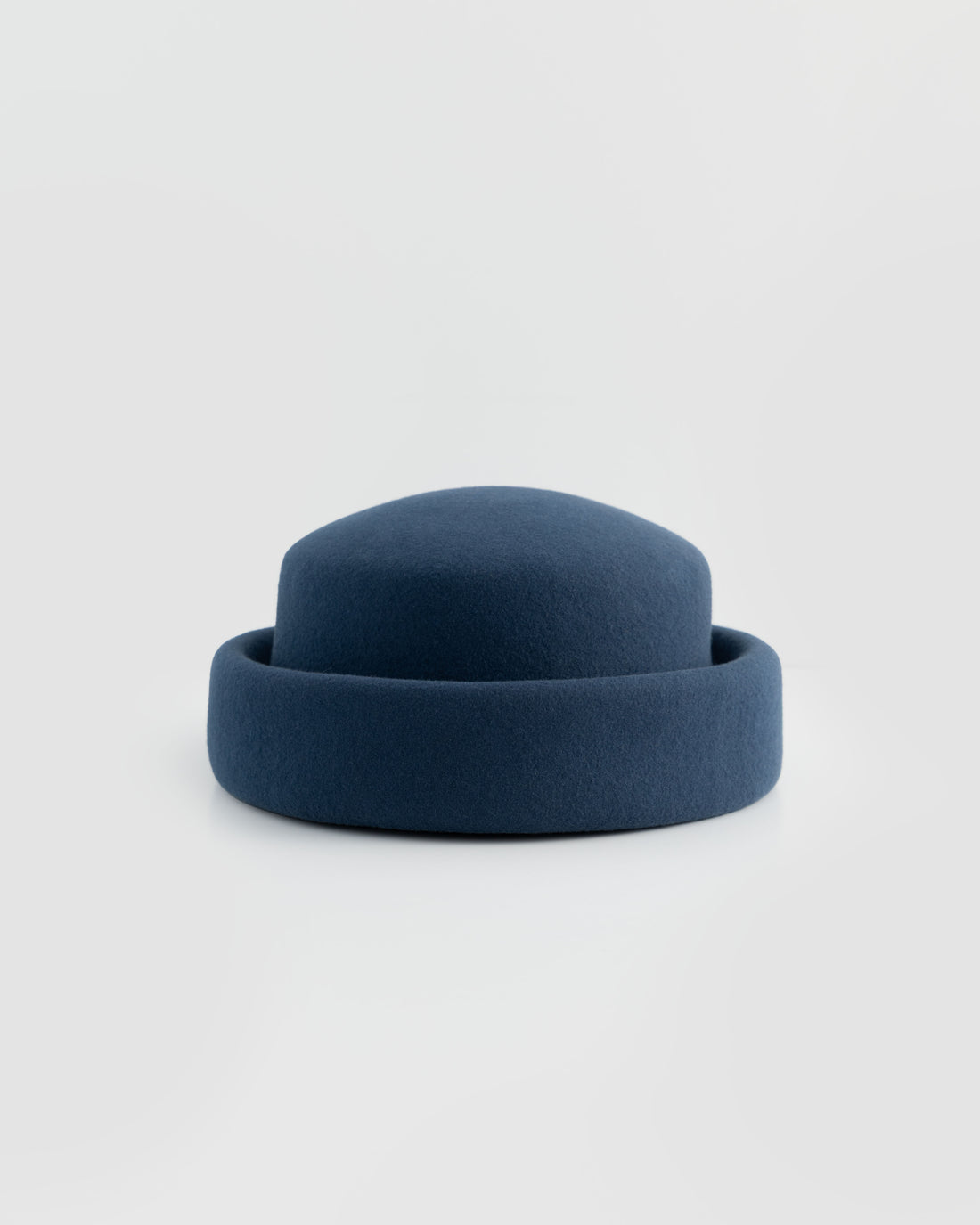 Born To Roam London Pillbox Hat in navy, stylish small round hat with a sleek, classic design perfect for vintage-inspired fashion.