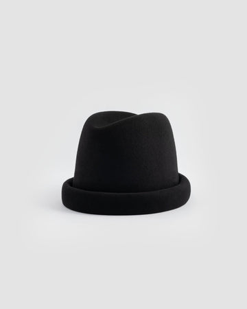 Born To Roam Alpine black pillbox hat with a sleek, compact design perfect for stylish accessories.