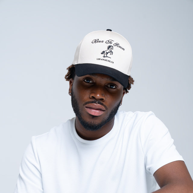 Cream American Trucker Cap by Born To Roam featuring mesh back, curved brim, and classic trucker style.