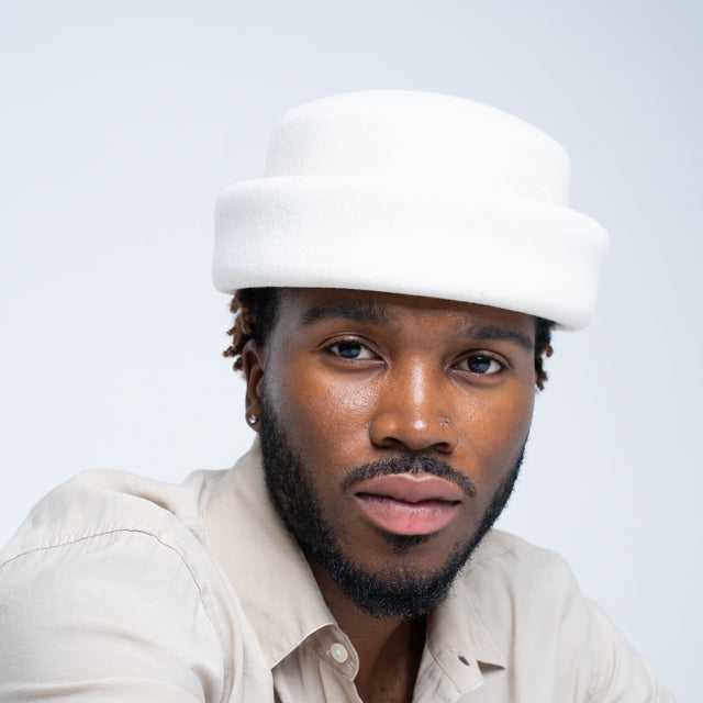 Ivory London Pillbox hat by Born To Roam, stylish accessory with a classic, structured design perfect for elegant occasions.