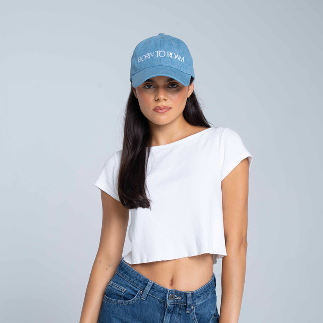Born To Roam Queens Baseball Cap in classic denim, featuring a curved brim and adjustable strap for a casual, stylish look.