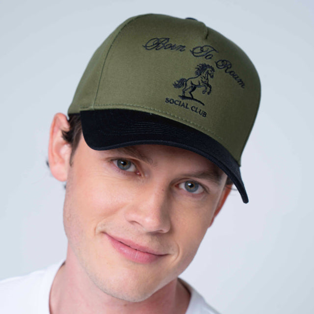 Olive green American Trucker Cap by Born To Roam featuring a classic baseball cap design with mesh back panels.