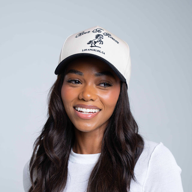 Born To Roam American Trucker Cap in creme, classic baseball cap with mesh back and curved brim, casual streetwear style