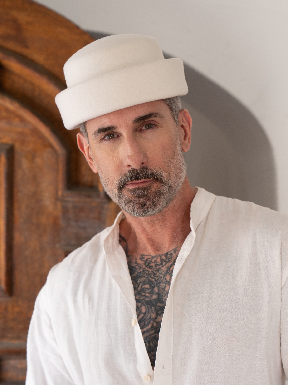 Ivory London Pillbox hat by Born To Roam with a sleek, structured design and elegant embellishments, perfect for stylish occasions.