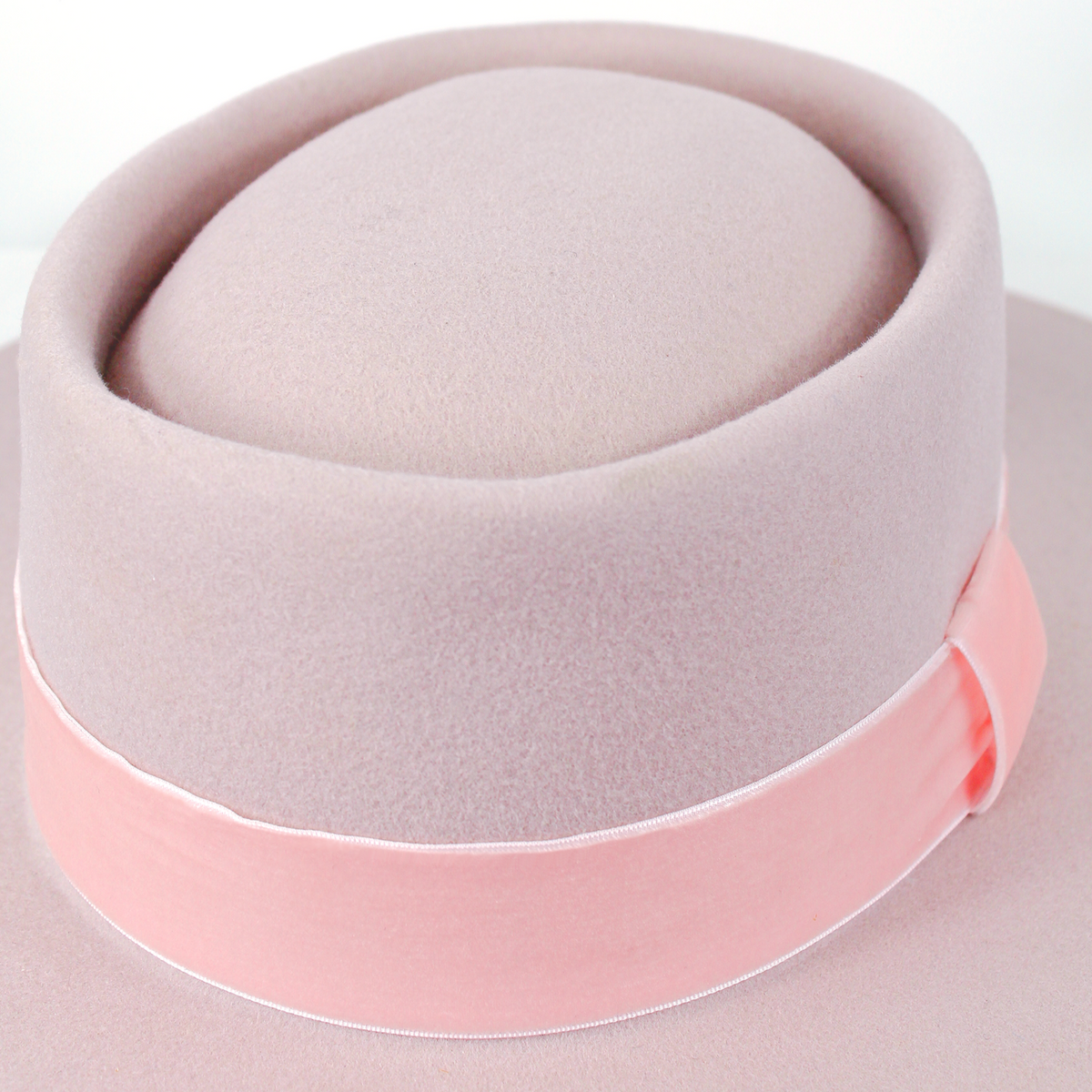 Born To Roam Kayo Blush Pink Boater Hat with wide brim and elegant ribbon, perfect for stylish summer accessories.