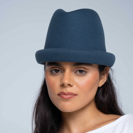 Navy Russian pillbox hat by Born To Roam featuring a sleek, structured design and a short brim, perfect for classic style.