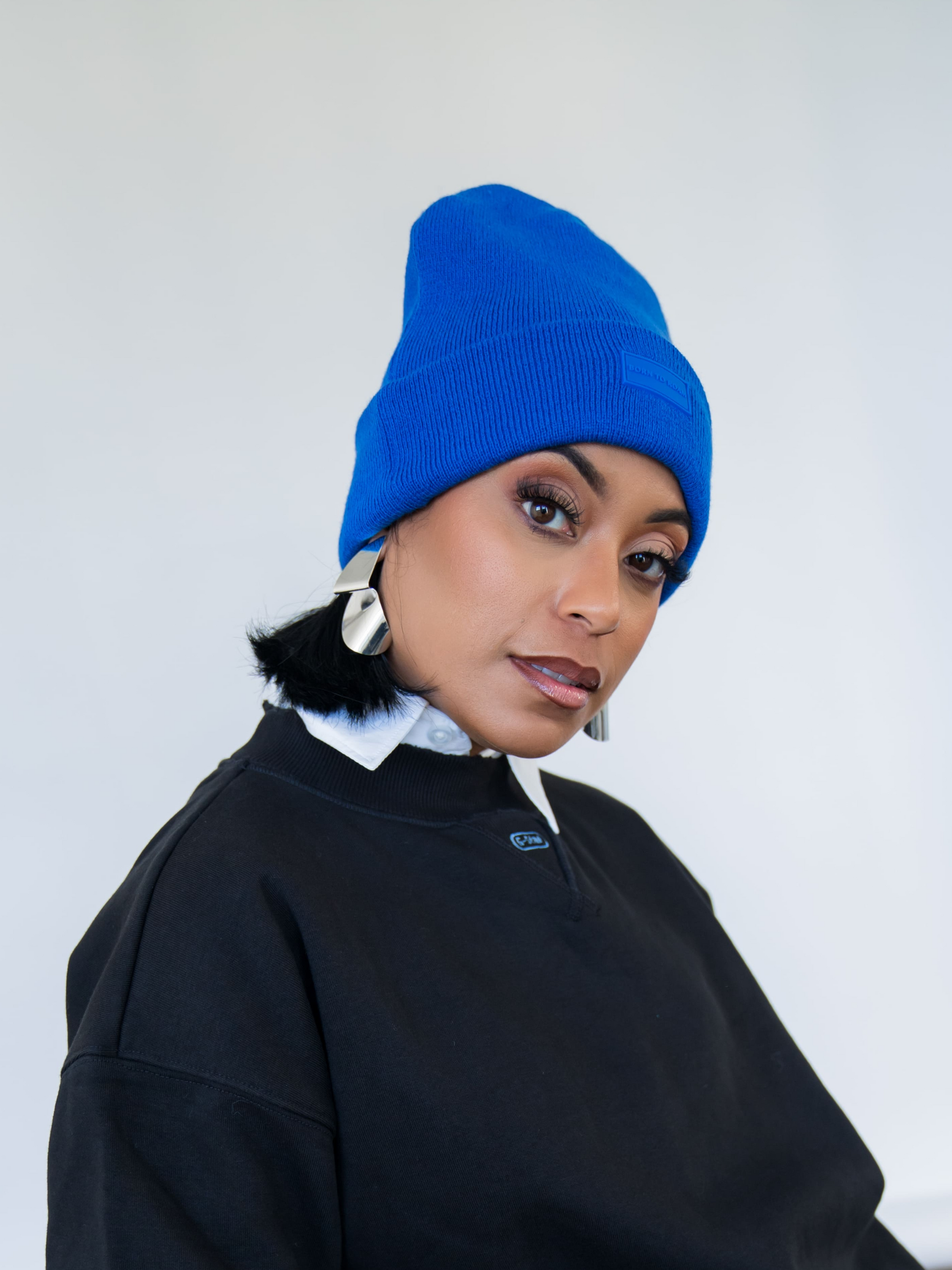 Cobalt blue Vail Knit Beanie by Born To Roam, featuring a cozy, ribbed knit design perfect for winter wear.