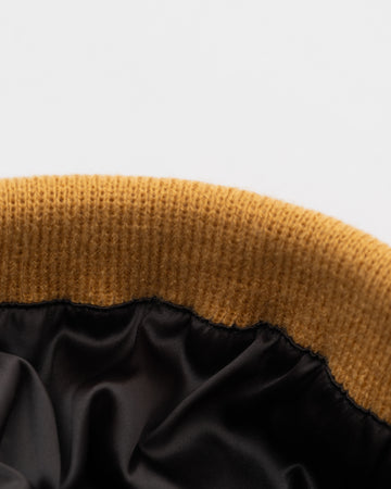 Born To Roam Vail Knit Beanie in tan, cozy wool hat with ribbed texture and folded brim, ideal for cold weather.