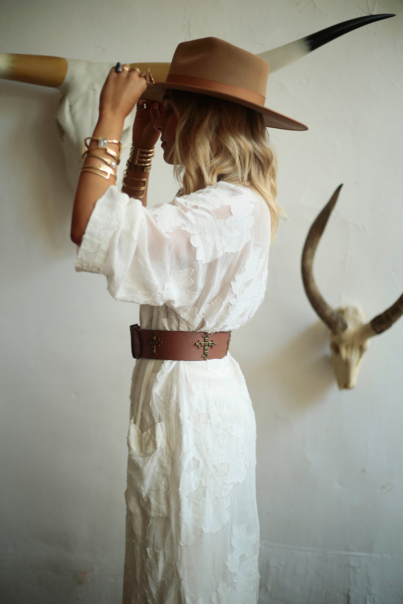 Elegant woman donning Roma belt in brown