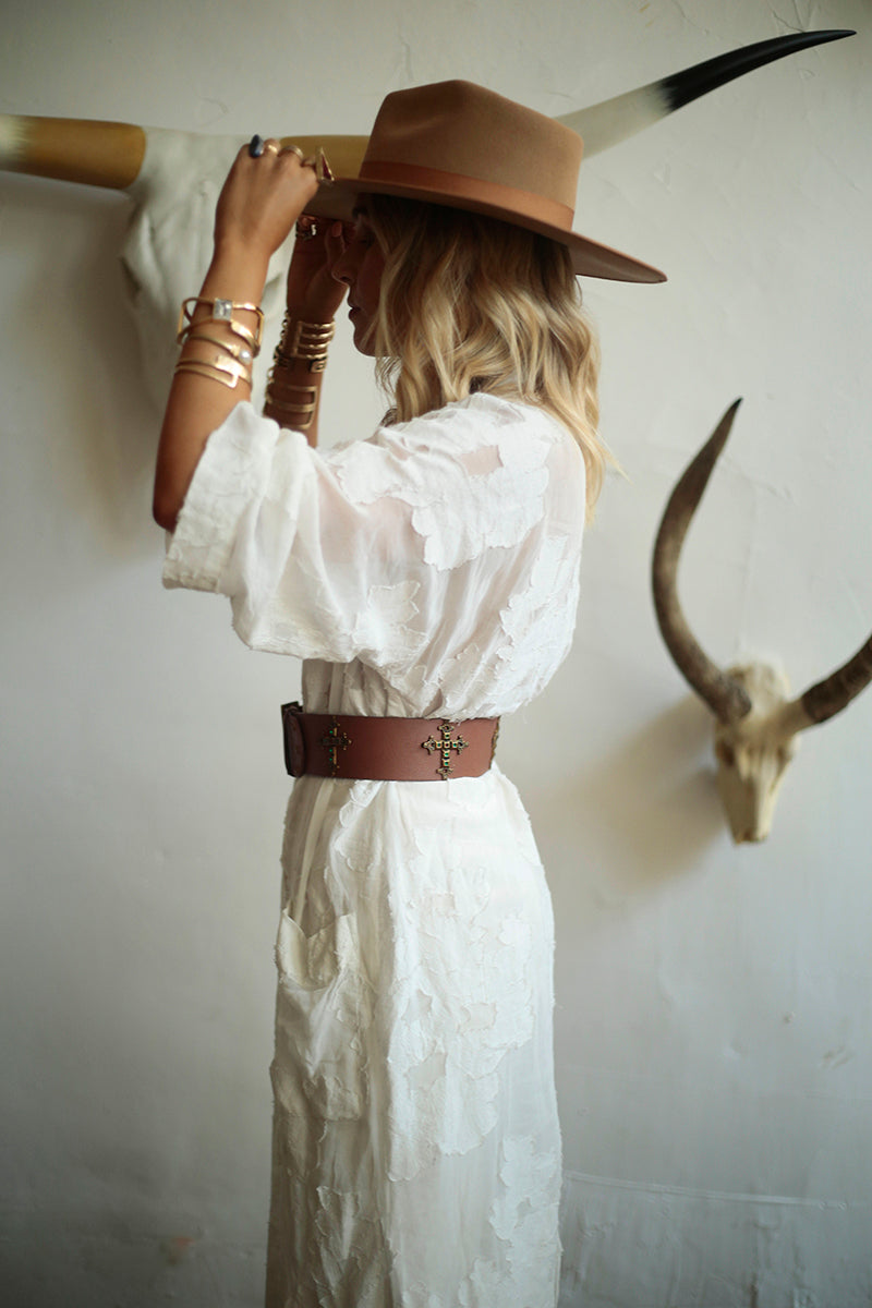 Brown Roma leather belt by WeAreBornToRoam, featuring a classic design with a metal buckle and smooth finish.