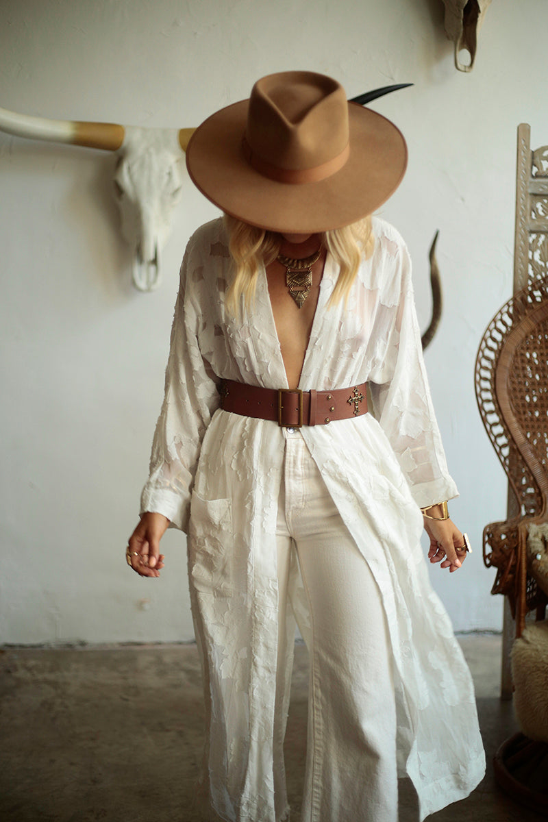 Brown Roma leather belt by WeAreBornToRoam featuring a classic design and sturdy buckle.