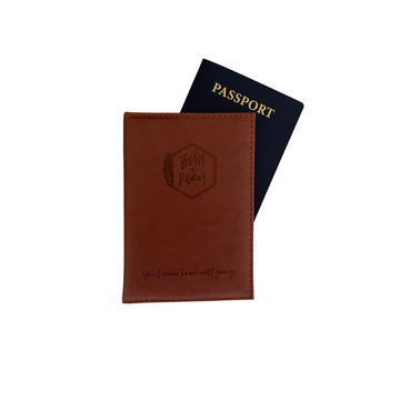 Born To Roam passport cover with graphic design, durable fabric, and secure closure for travel accessories.