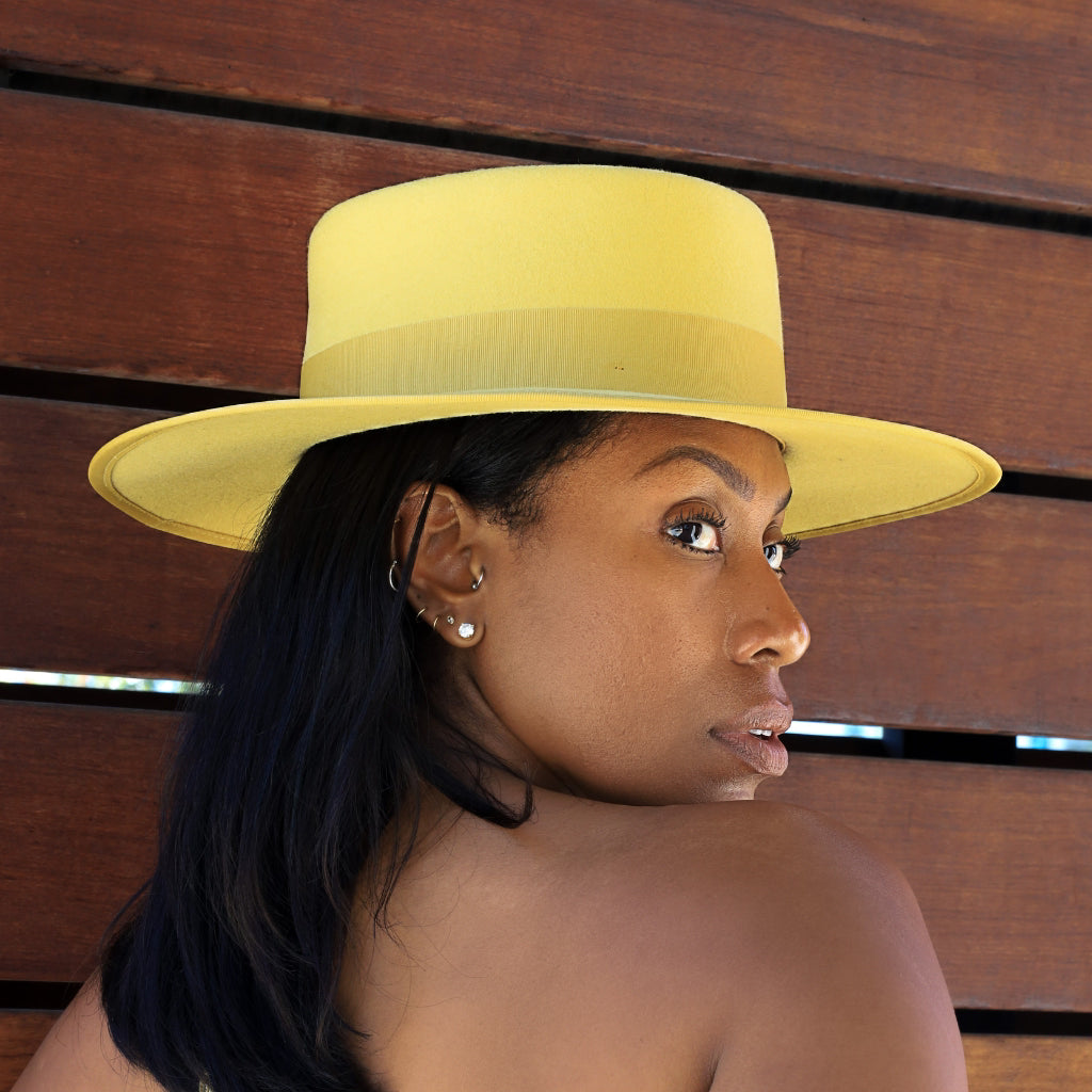Chic boater hat in bold yellow hue