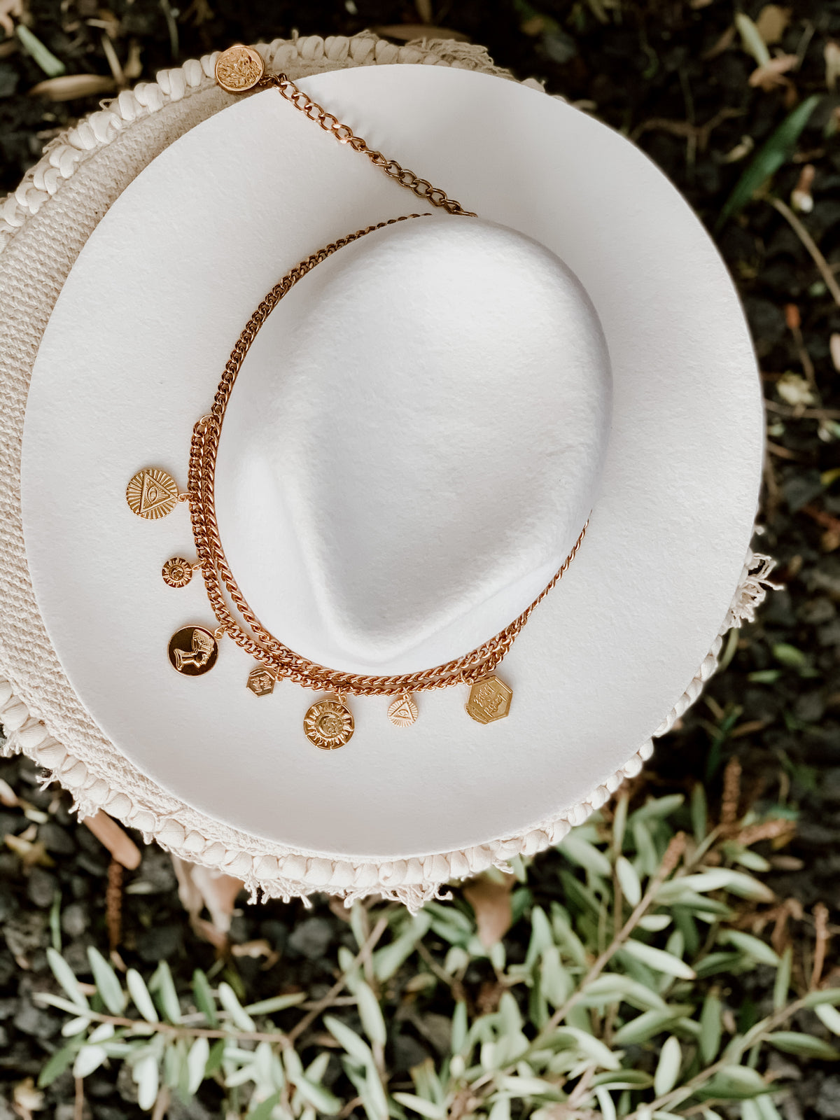 Born To Roam Treasured Chain Belt Necklace showing a gold chain belt with intricate links and clasp detail.