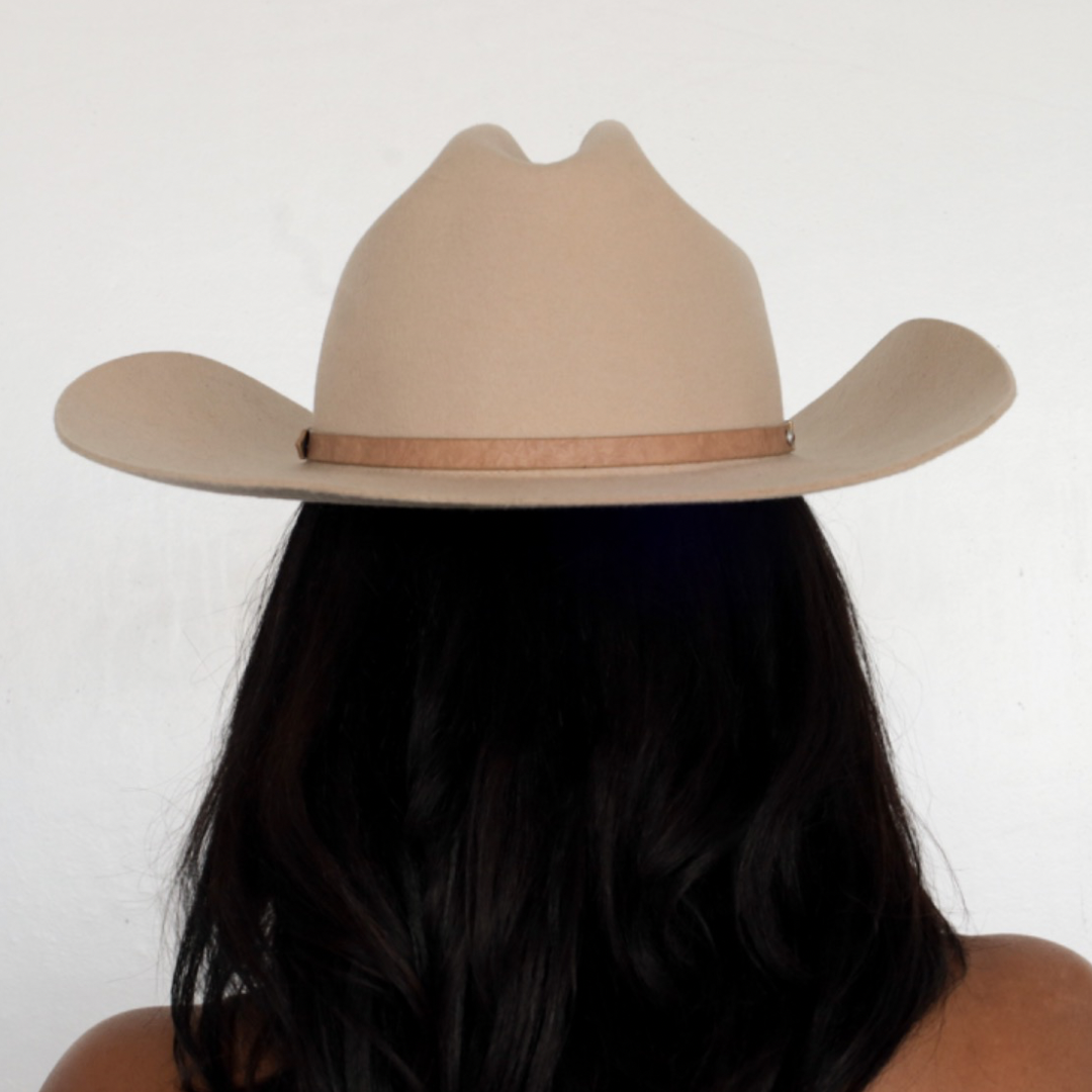 BornToRoam - women posing by wearing Upland Cattleman Cowboy Hat in Tan back view
