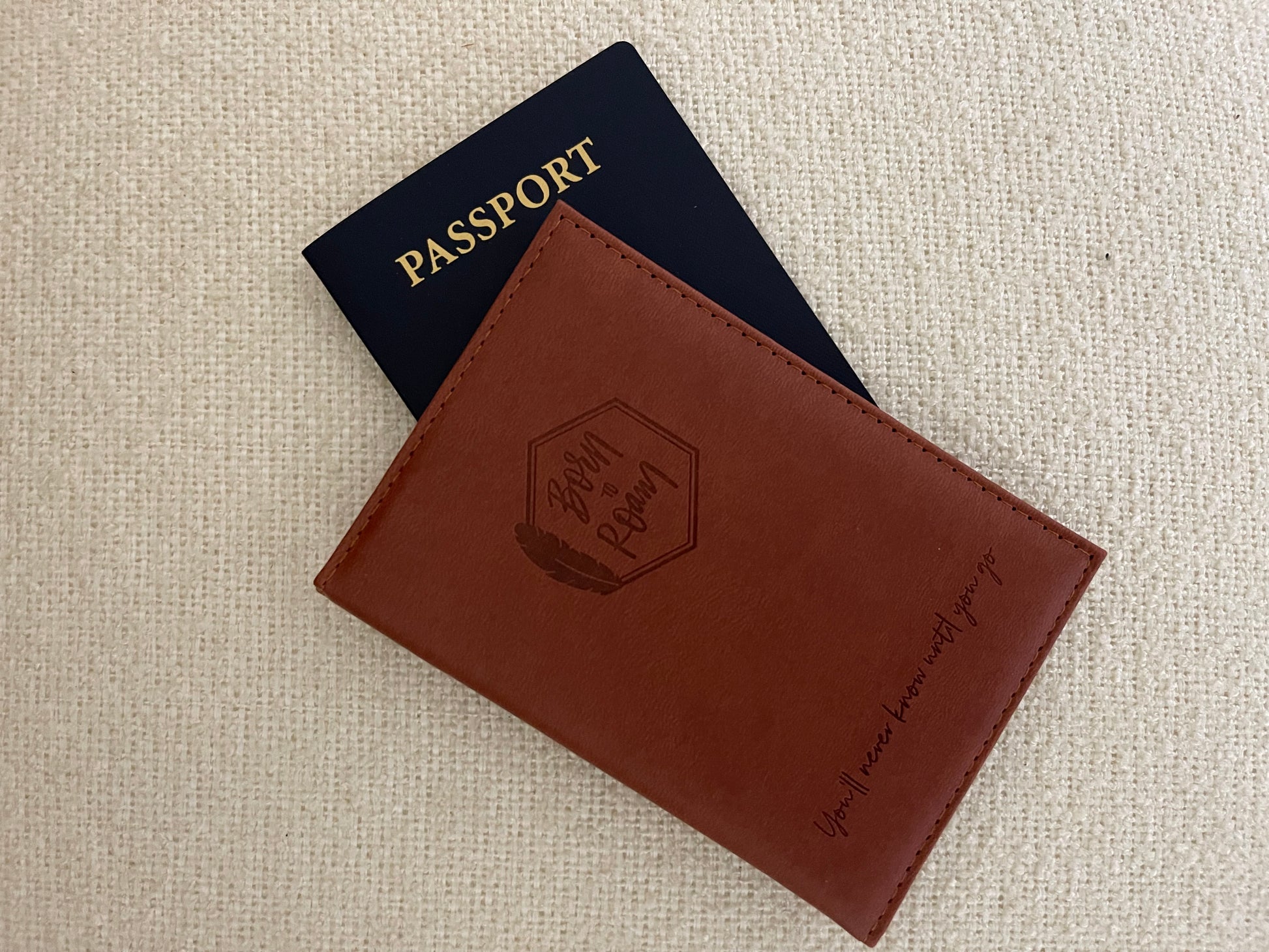 Born To Roam passport cover with rugged leather design and embossed logo, ideal for travelers and adventurers.
