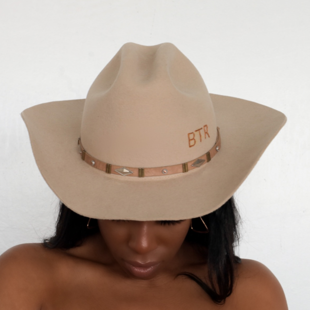 BornToRoam - women posing with face down by wearing Upland Cattleman Cowboy Hat in Tan