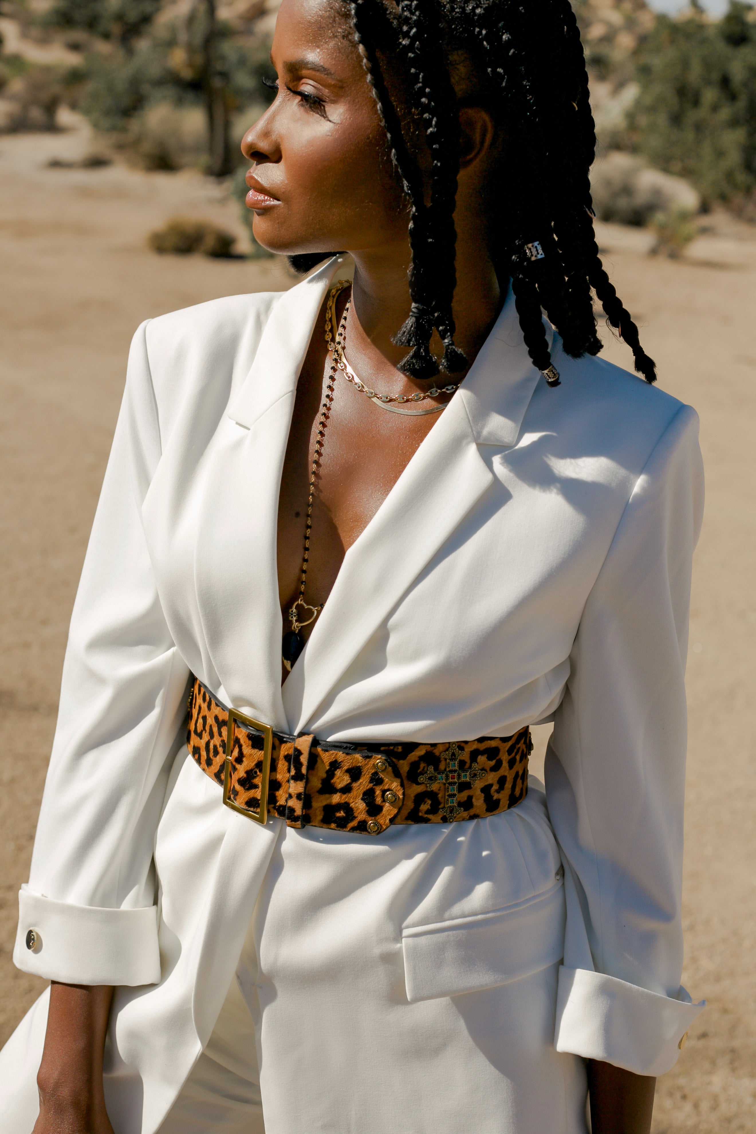 Leopard print Roma calf hair belt by WeAreBornToRoam featuring a sleek design and adjustable buckle.